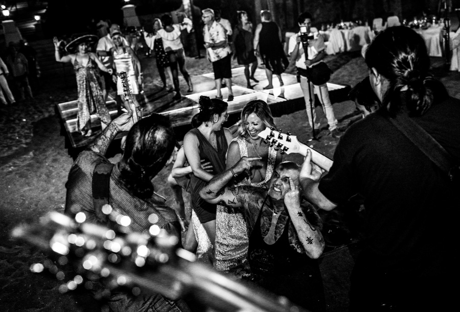 Crazy uncle dancing with the rock band in the wedding party