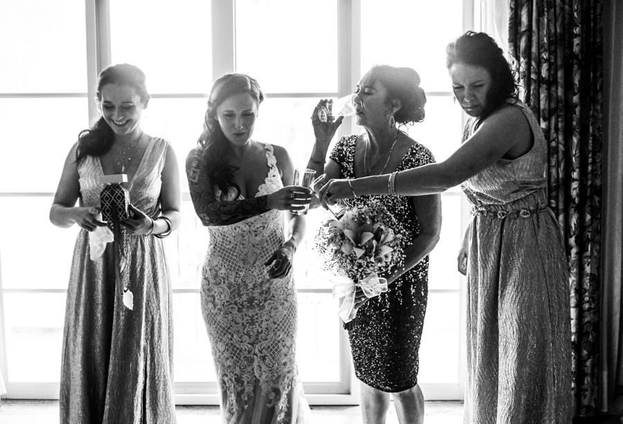 Bride, her sister and her mother drinking tequila
